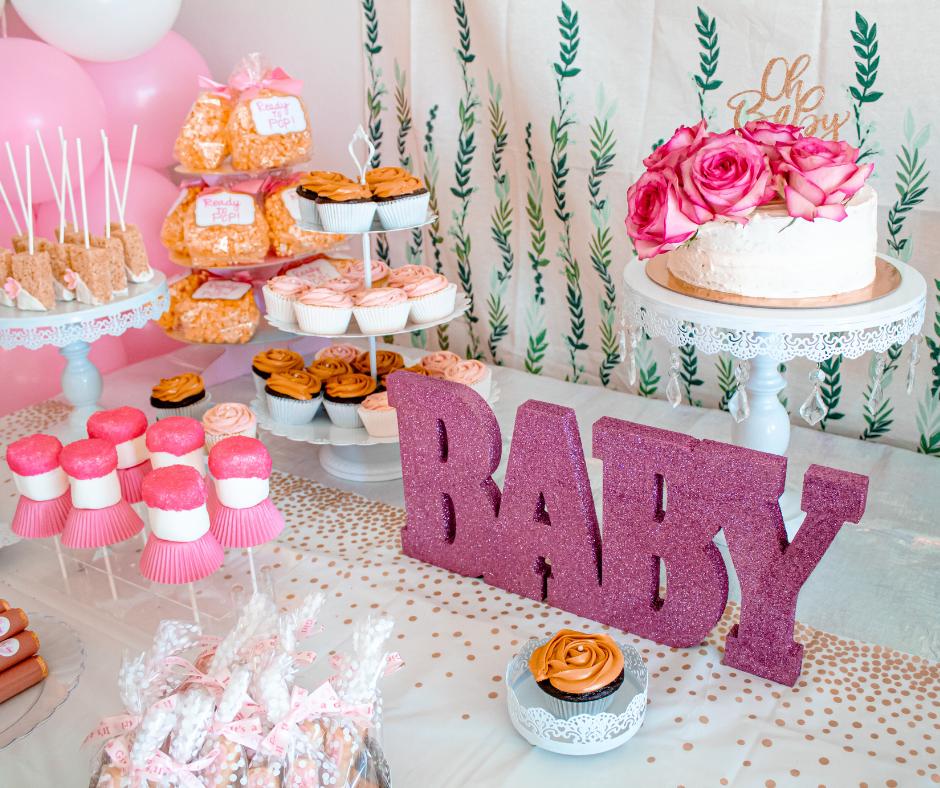 Baby shower decorations laid out on a table
